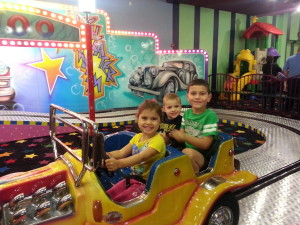 Grandkids in cars at John's Pizza